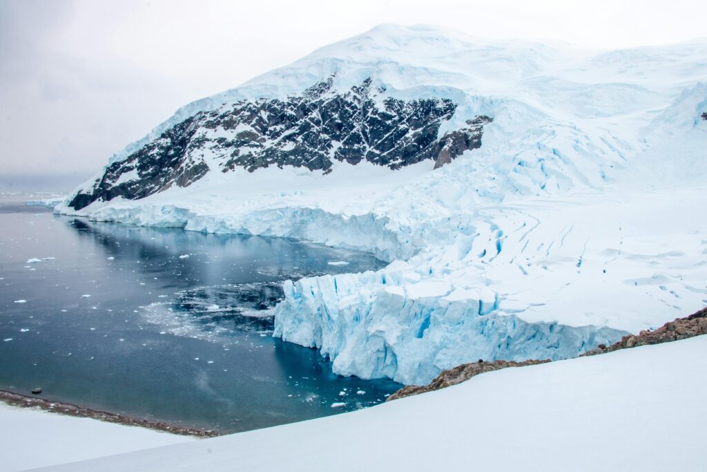 Stunning view of icy cliffs and pristine waters in Antarctica, capturing the essence of the remote continent.